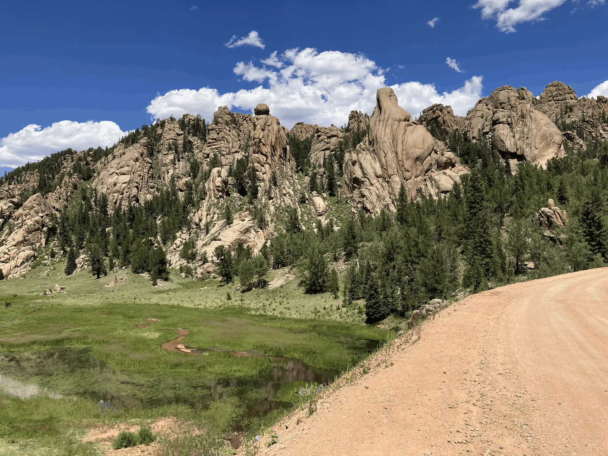 Granite spires above a mountain meadow along the dirt road up to Victor, Colorado